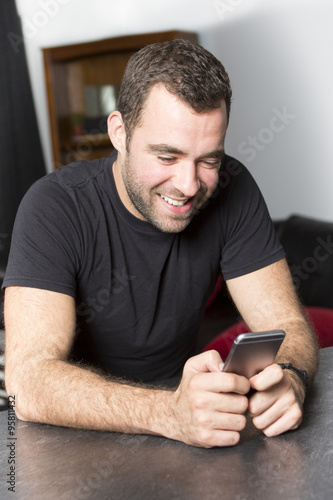 Portrait of happy young man at home