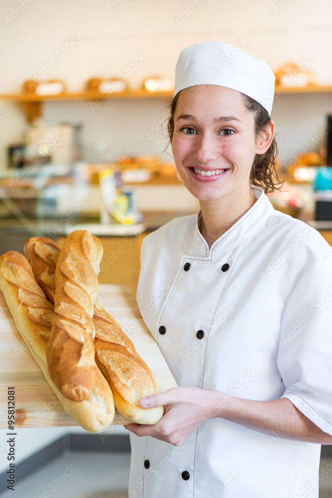 Young attarctive baker working at the bakery Stock Photo Adobe Stock