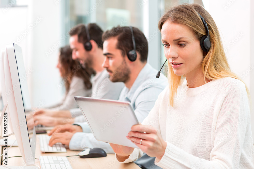 Young attractive woman working in a call center Young attractive woman working in a call center