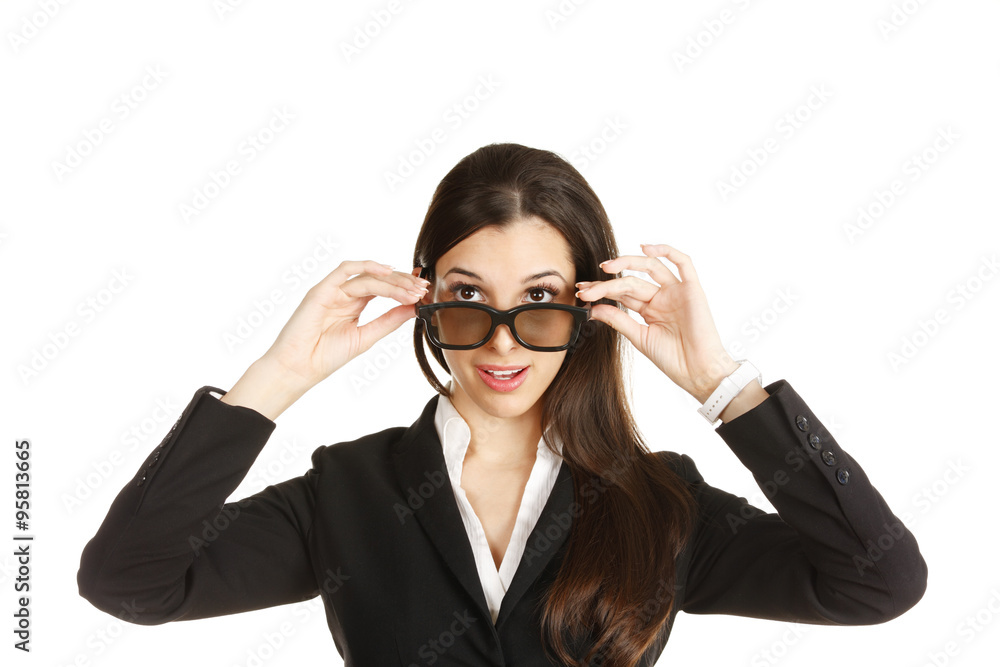Woman tips and looks over her 3D glasses. Woman tips and looks over her 3D glasses.