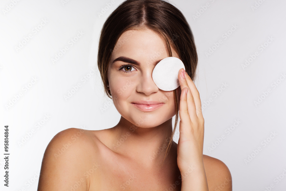 Pretty girl with flawless skin and cotton wool in hand Pretty girl with flawless skin and cotton wool in hand