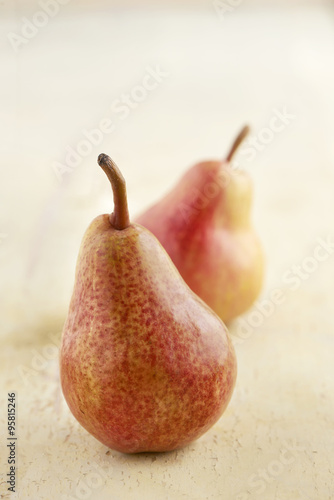 Pair of Red Pears on Painted Rustic Wooden Table