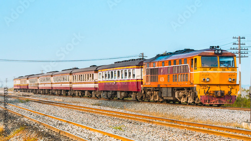 Rapid passenger train was passing through station in suburban, 2013.