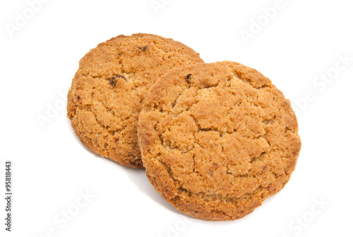 Two oatmeal cookies on white