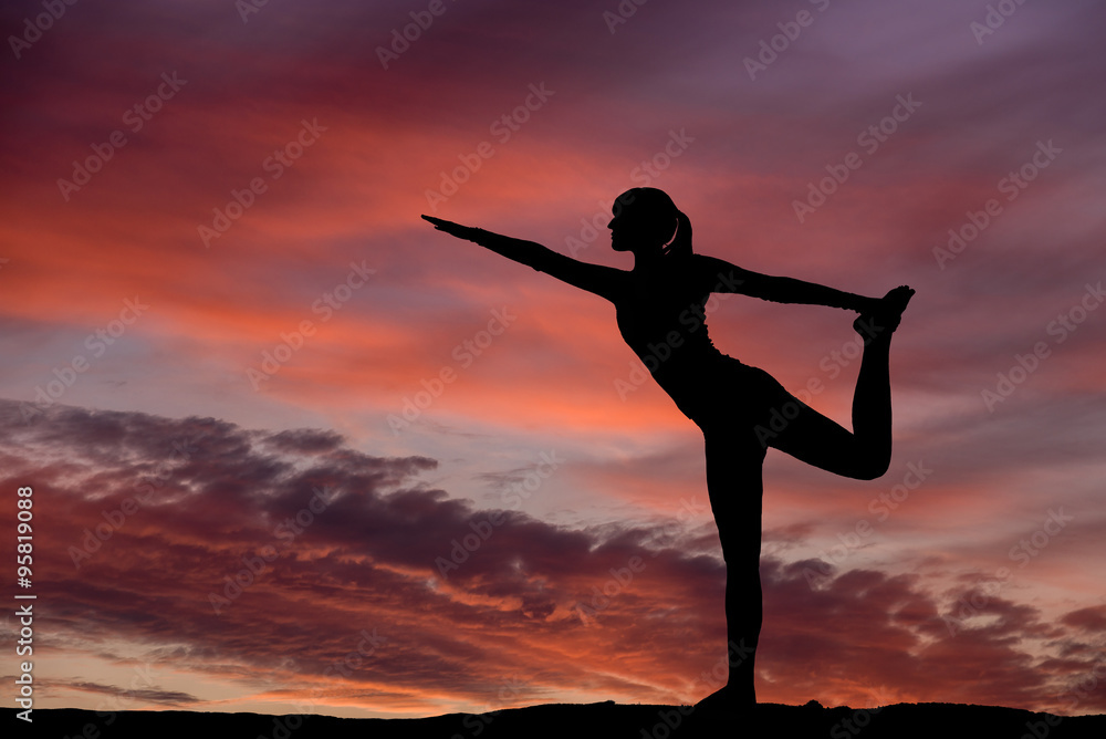 Yoga silhouette outdoor at sunset