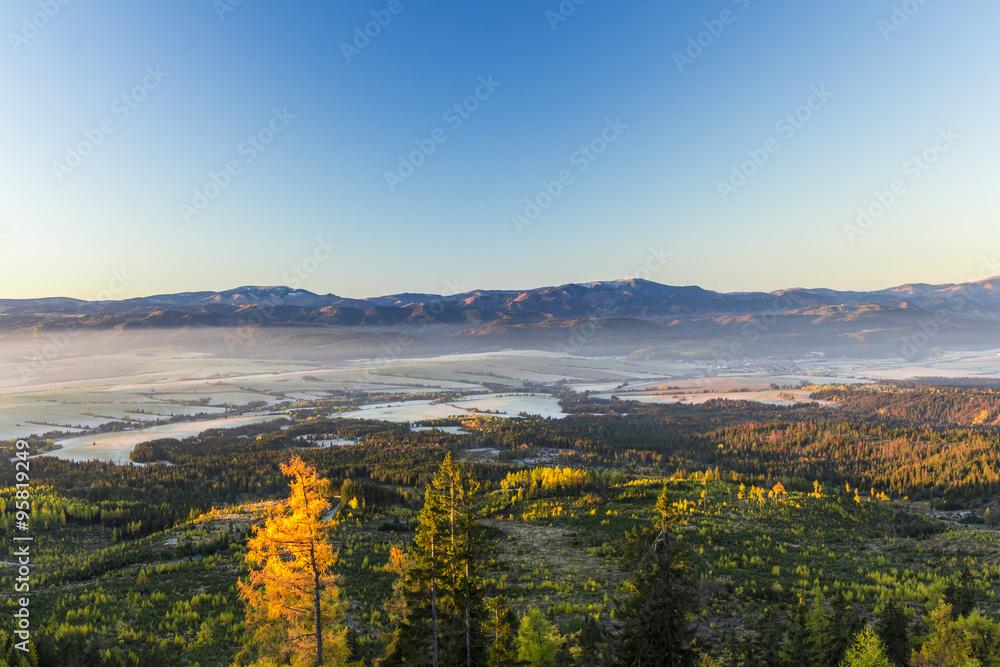 View from High Tatras, Mountain ridge of Low Tatras and Valley in fog at sunrise, Slovakia