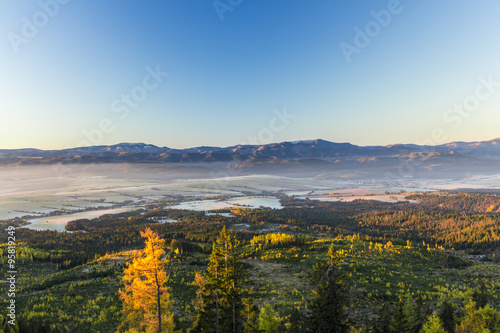 View from High Tatras  Mountain ridge of Low Tatras and Valley in fog at sunrise  Slovakia