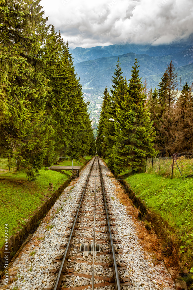 Fototapeta premium Railroad tracks for mountain lift on Gubalowka, Poland.