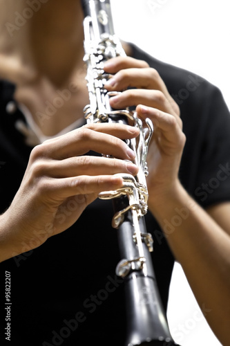 Hands musician playing the clarinet 