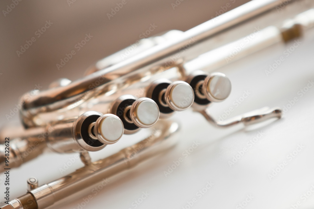 Fototapeta premium Detail of the trumpet closeup in golden tones