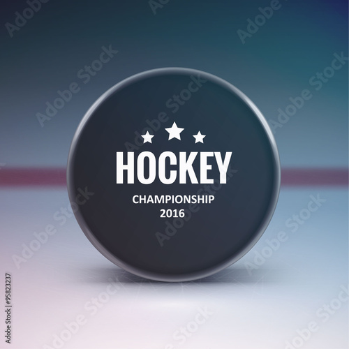 Hockey puck isolated on ice with blur 