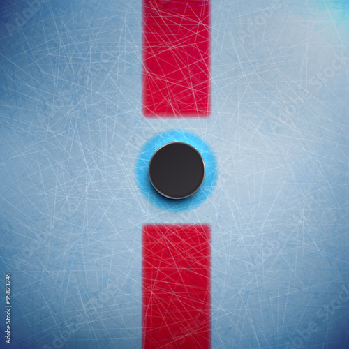 Hockey puck isolated on ice top view 