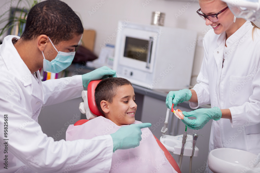children's dentist explains to the child how to properly wash th children's dentist explains to the child how to properly wash th