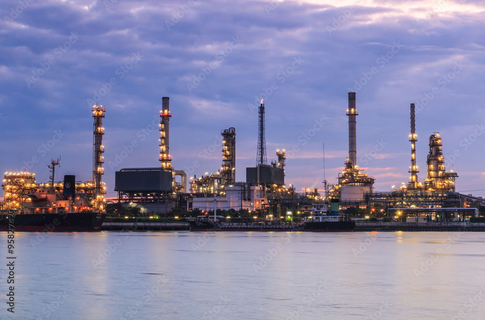 Oil refinery with sunset sky