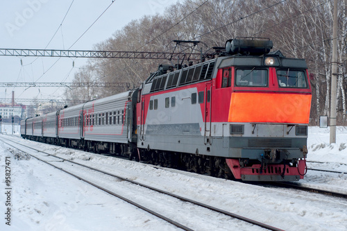 passenger train traveling in the winter