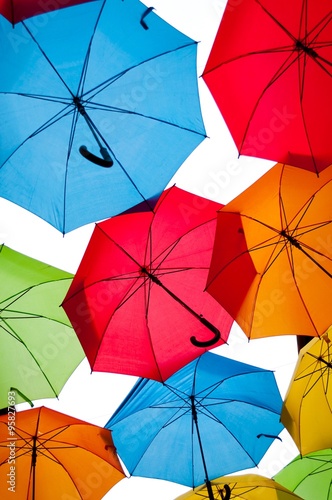 Many colorful umbrellas against the sky in city settings. Kosice  Slovakia. Color background