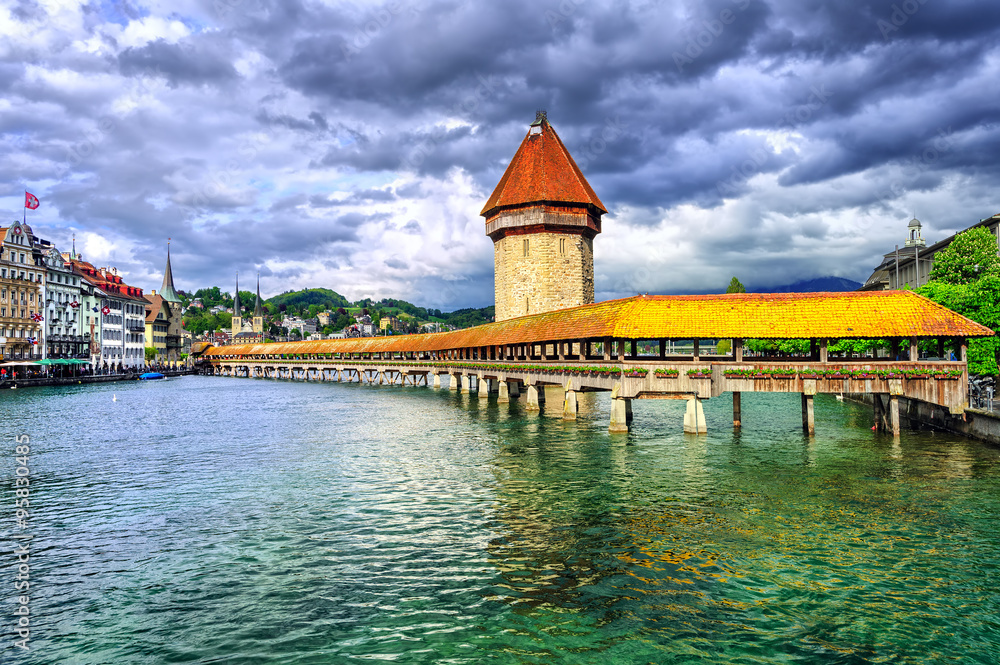 Lucerne, Switzerland, medieval wooden Chapel bridge over Reuss river and Water tower
