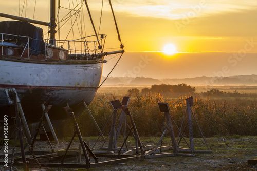 Fototapeta Naklejka Na Ścianę i Meble -  boat on the hard at sunrise
