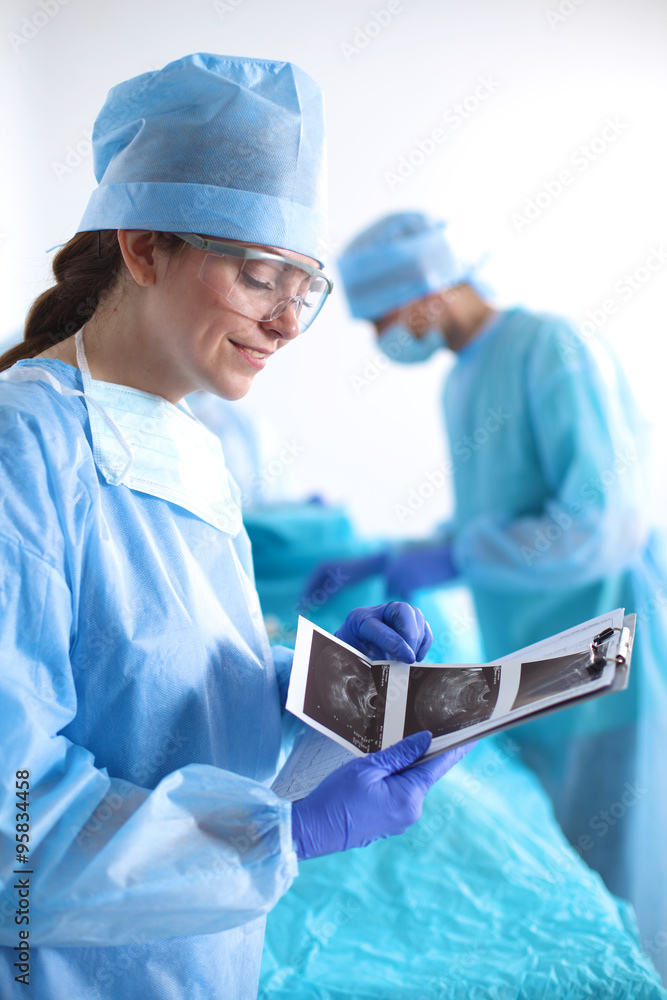 Team of surgeon in uniform perform operation on a patient at cardiac surgery clinic Team of surgeon in uniform perform operation on a patient at cardiac surgery clinic