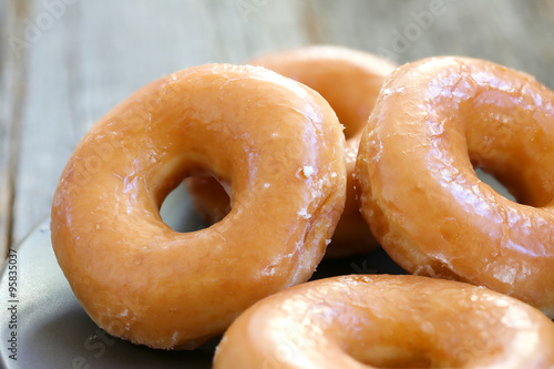 Fotografie, Tablou Glazed donuts background image. Macro with shallow dof.