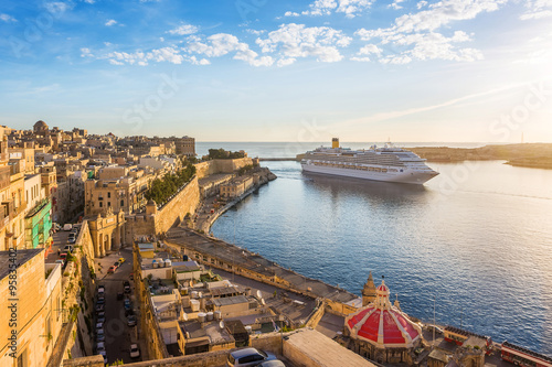 The ancient walls of Valletta and Malta harbor with cruise ship in the morning - Malta photo
