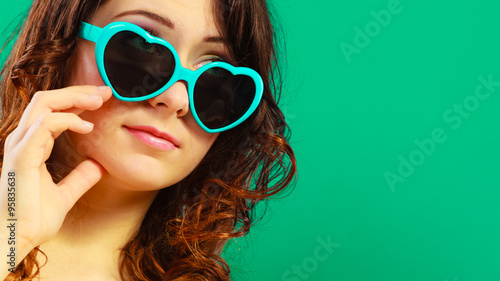 Girl in green sunglasses portrait
