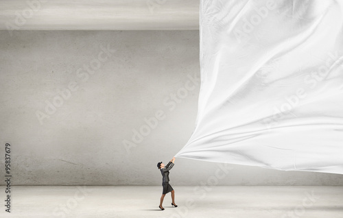 Woman pulling clothing banner