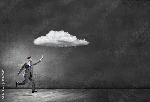 Businessman catch cloud