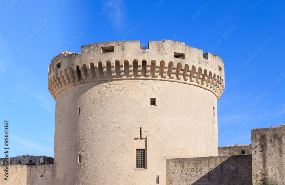 ruins of medieval old tower of castle under blue sky