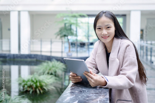 Girl playing the Tablet PC © snvv