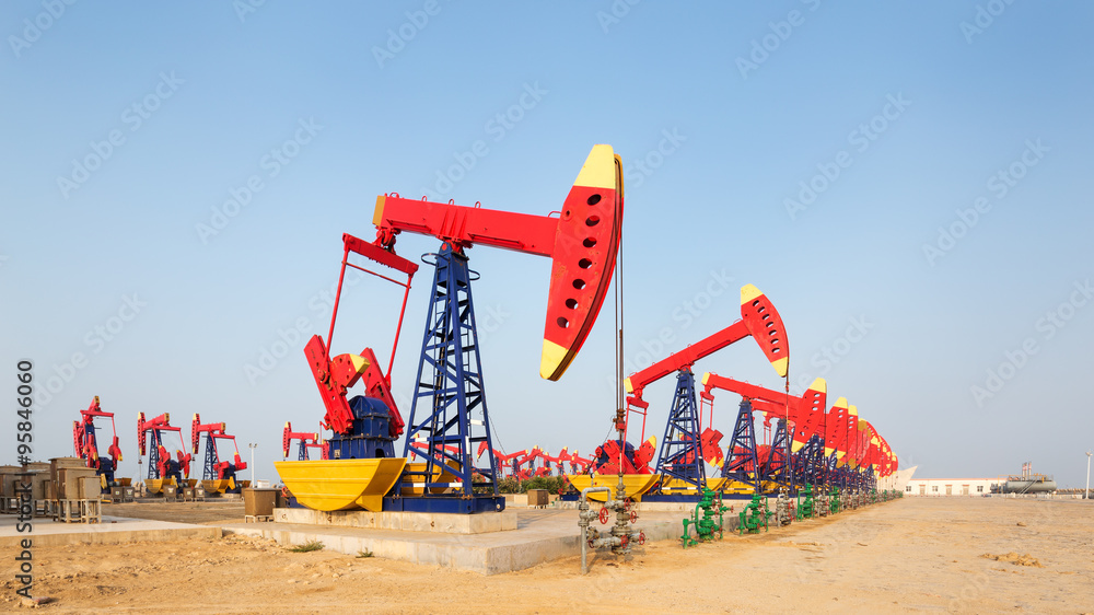 Fototapeta premium view of oilfield with pump units running