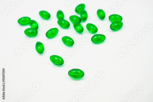 green pills soft gel capsule isolated on white background
