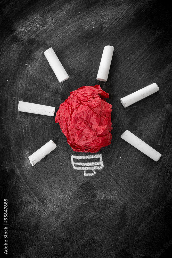 Idea concept, crumpled red paper on the chalkboard turned into a Idea concept, crumpled red paper on the chalkboard turned into a