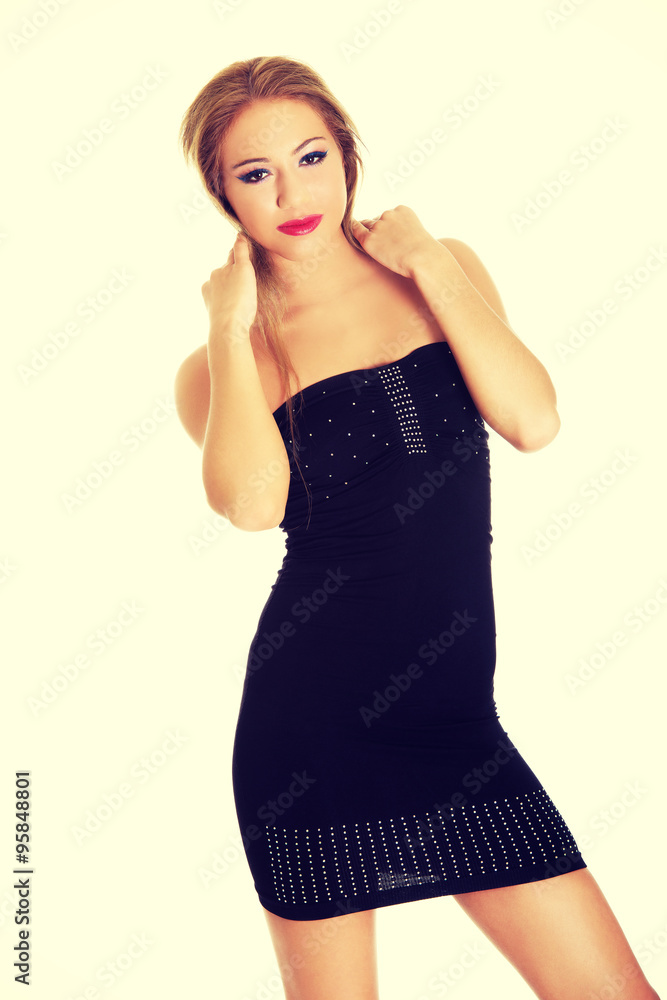 Young woman wearing party dress. Young woman wearing party dress.