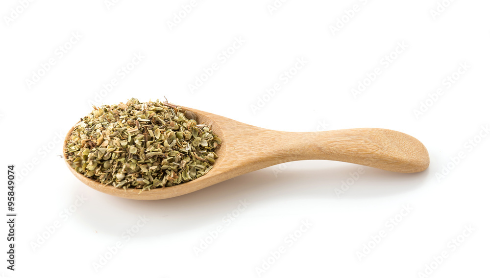 oregano on wood spoon oregano on wood spoon