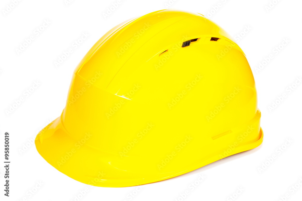Fototapeta premium Closeup of yellow protective helmet on white background