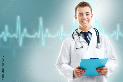Male Doctor holding clipboard