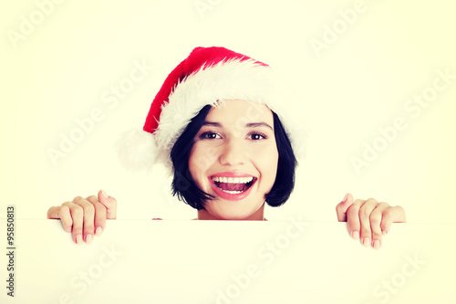 Santa girl holding blank board