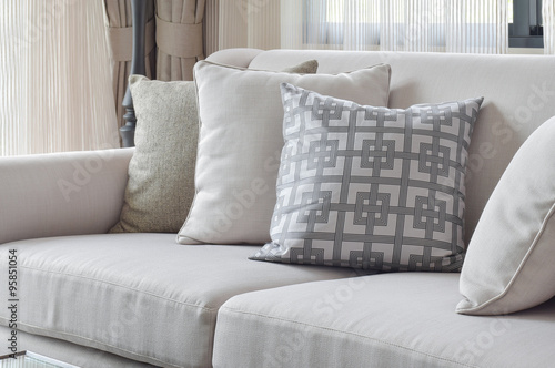 Earth tone sofa set with varies pattern pillows in living room