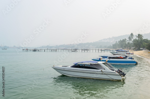 Speed Boats moored on tropical sea in Samui Island,Thailand with foggy sky. © aon_skynotlimit