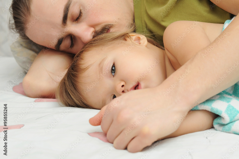 Father holding ailing baby hands Father holding ailing baby hands