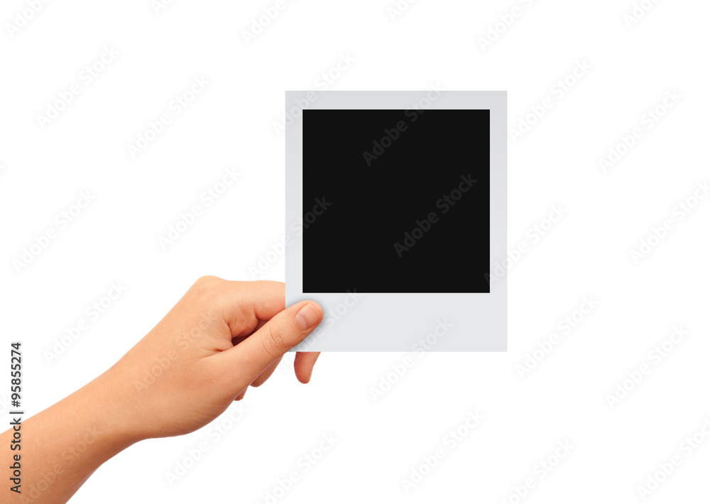 Hand with blank photo card - obrazy, fototapety, plakaty 