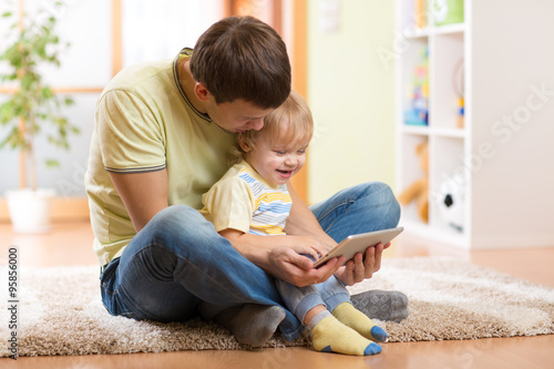 Daddy and son kid playing w...