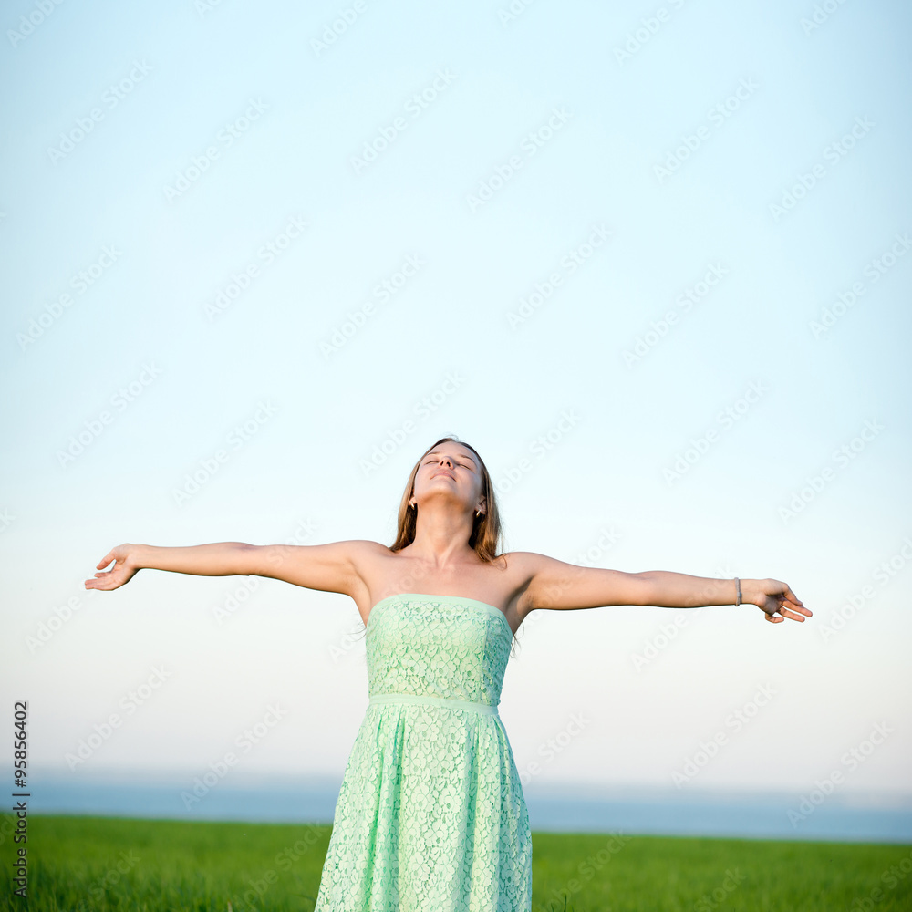 Happiness woman stay outdoor under sunlight of sunset Happiness woman stay outdoor under sunlight of sunset