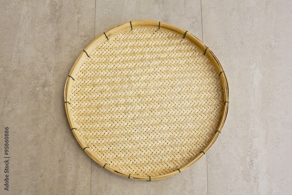 Thai Basketwork / Basketry made from bamboo on tile surface - background, copy space
Thai Basketwork / Basketry made from bamboo on tile surface - background, copy space