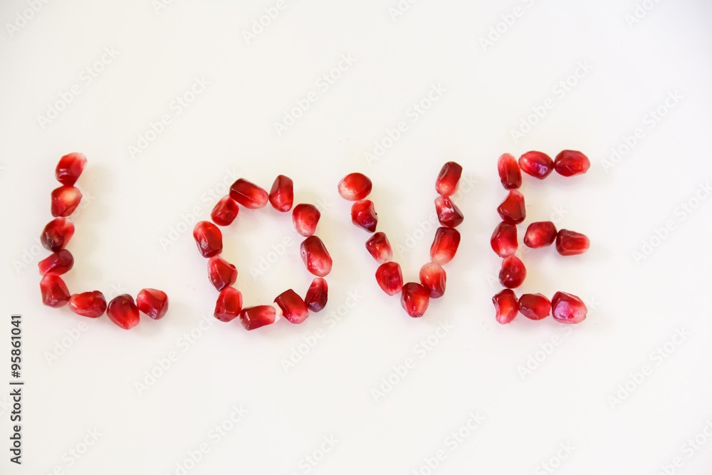 Inscription love. Letters from berries pomegranate. Inscription love. Letters from berries pomegranate.