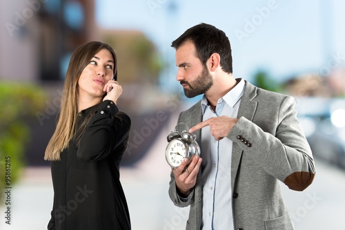 Angry man because his girlfriend has been late for an appointmen photo