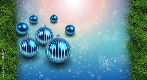 Christmas background with blue shiny balls and fir branches