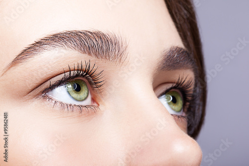 Fototapeta Naklejka Na Ścianę i Meble -  female eye zone and brows with day makeup