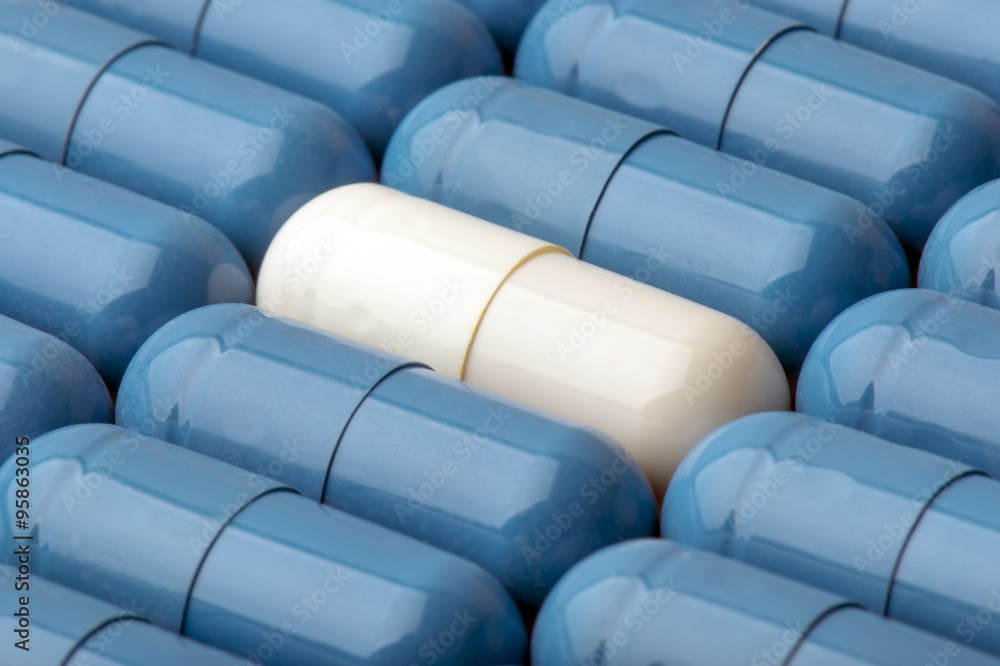 White and blue capsules as background- macro. White and blue capsules as background- macro.